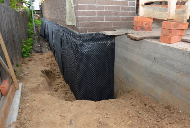 Happy homeowners after waterproofing job in Brandywine